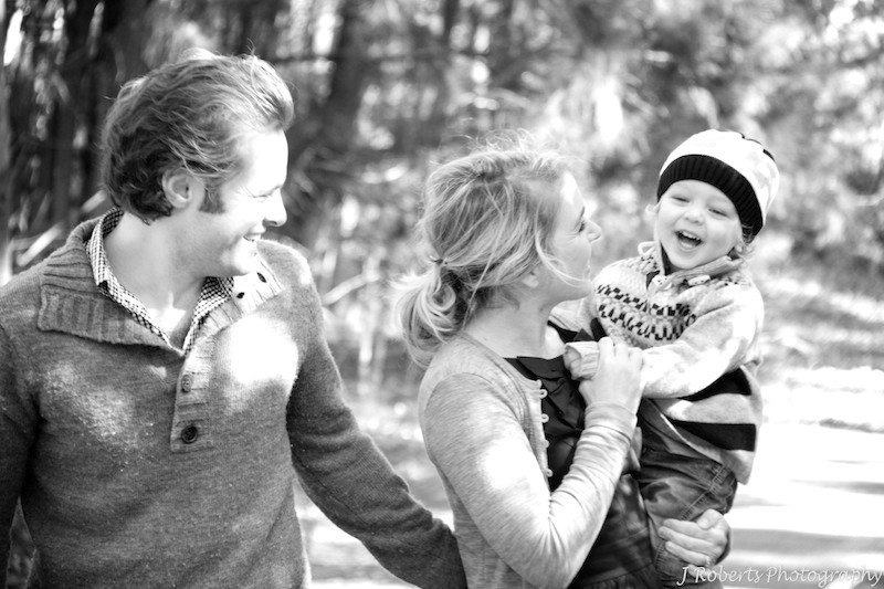B&W family of three walking in the park - family portrait photography sydney